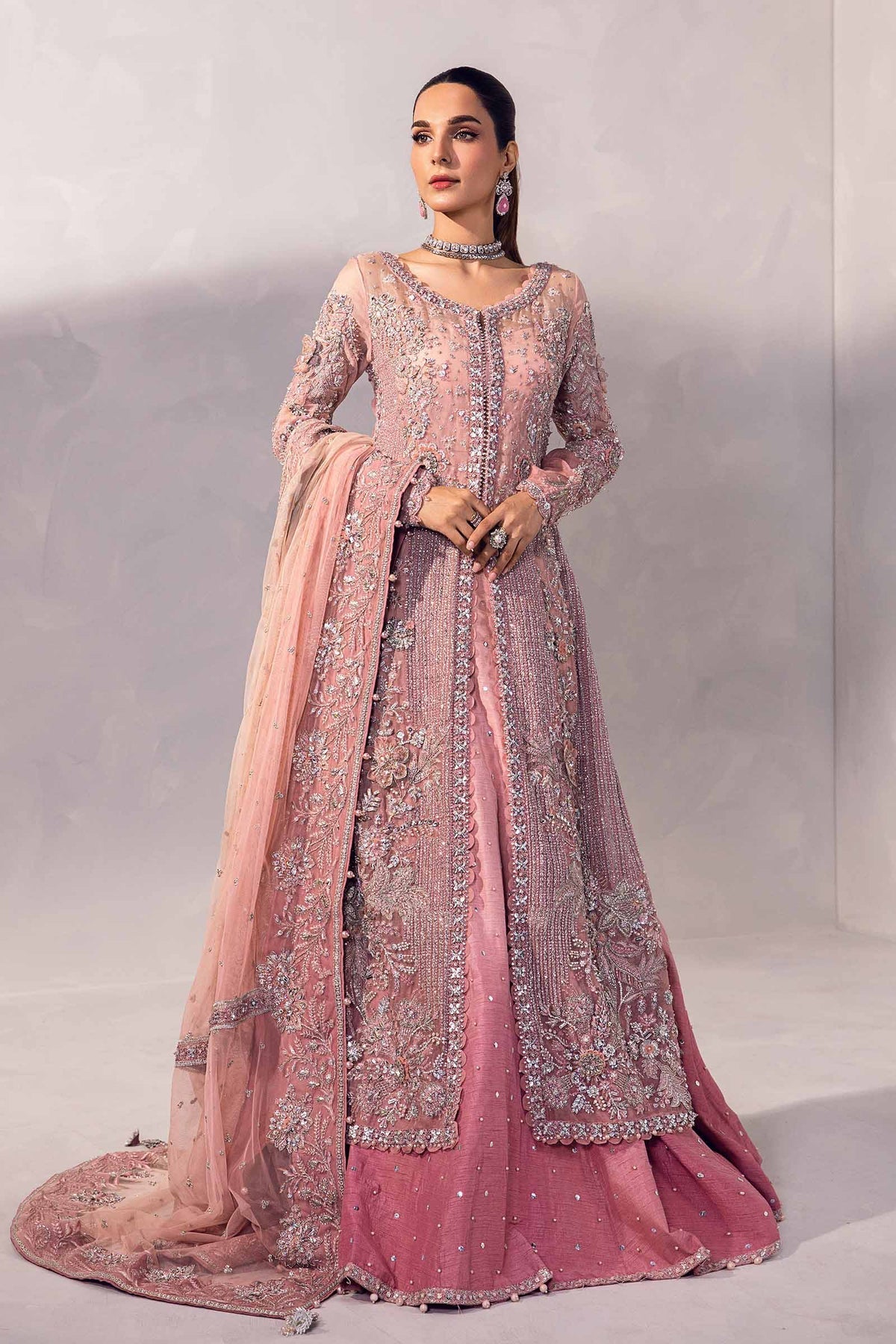 Resmin Pakistani indian bridal wedding dress mehndi nikkah suit usa uk australia canada europe Germany bridesmaid trending dresses guest luxury womens wear gift for her pakistani indian designer dreses
Indulge in the splendor of 'Resmin' Lehenga Set, bathed in a delicate blush pink hue. This artful craftsmanship is enveloped in timeless beauty with iridescent sequins, lustrous crystals &amp; glistening milky pearls. The ombre lehenga &amp; shirt stand as a divine embodiment of time-honored elegance. The exq